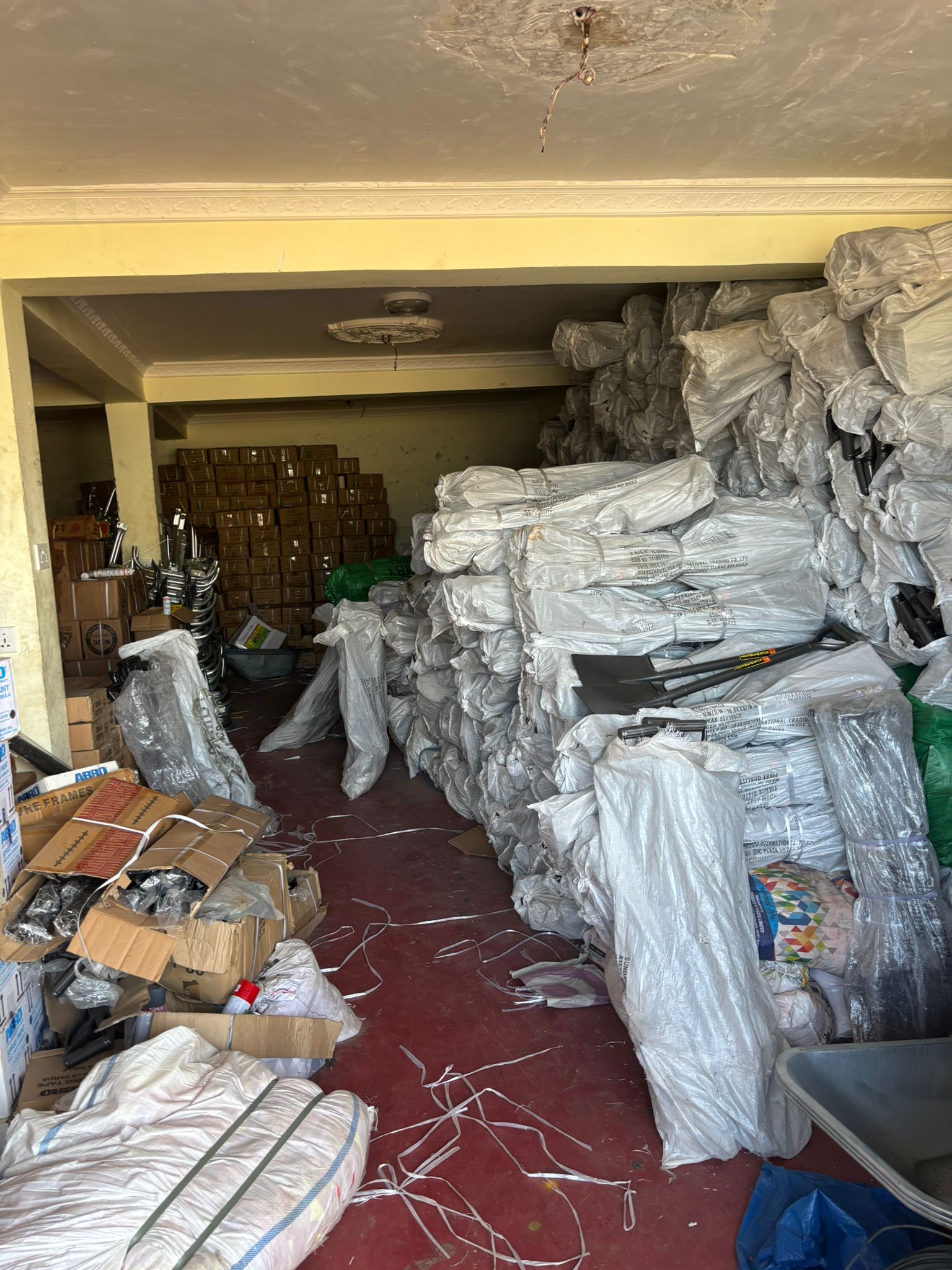 Interior view of Danwuk Enterprise warehouse with organized construction supplies inventory